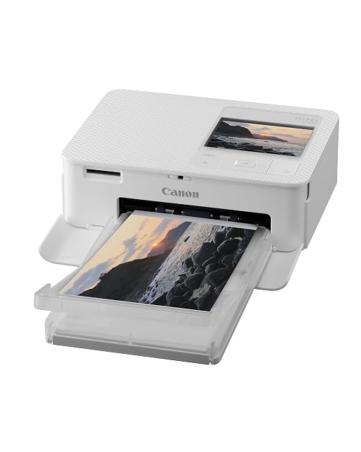 Canon SELPHY CP1500 avec sa cassette carte postale en place et son écran LCD allumé